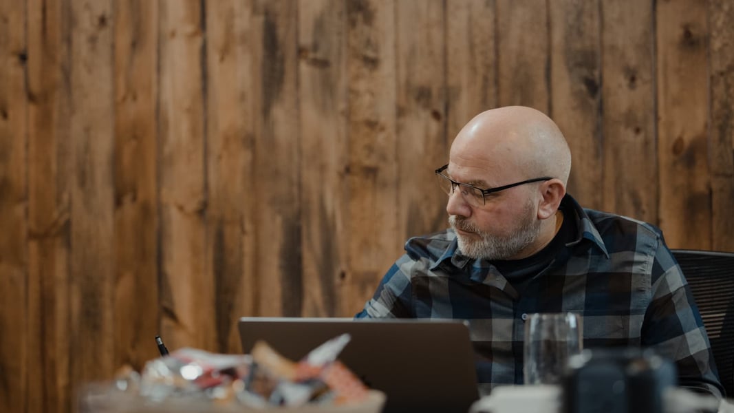 man setting business goals on laptop man setting business goals on laptop