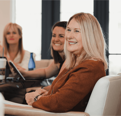 a woman engaged and productive in a meeting