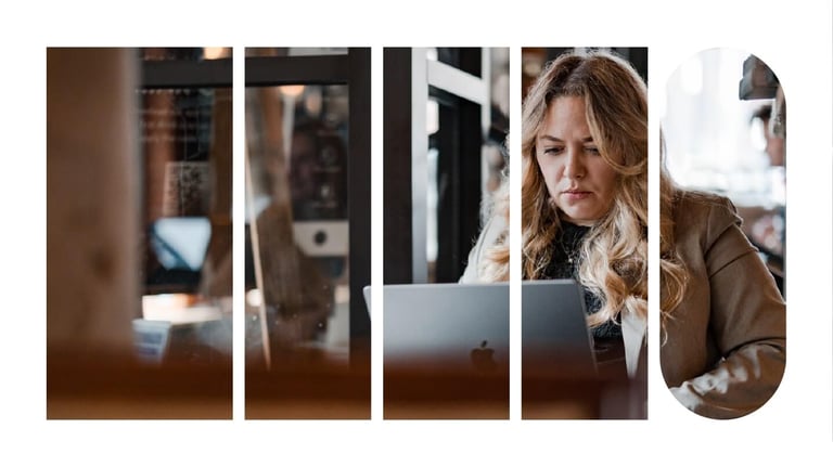 A woman in a cafe working on her laptop