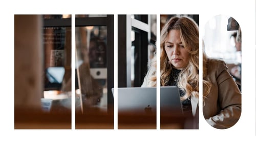 A woman in a cafe working on her laptop