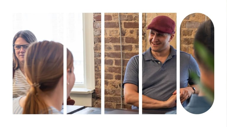 Employees having a meeting at a table.