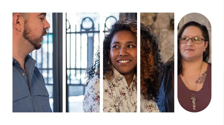 Colleagues in a cafe smiling and having a conversation.