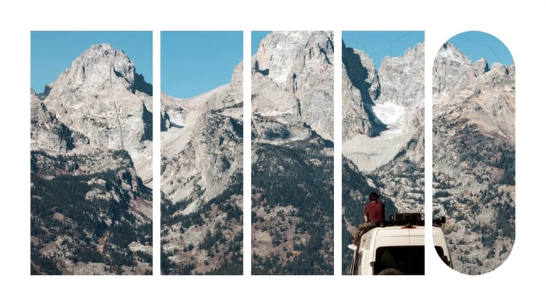 A van situated in front a mountain range.