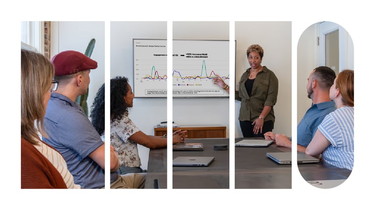 An employee giving a presentation with a slide deck behind her. Her colleagues are seated at a table in front of her and are looking on.
