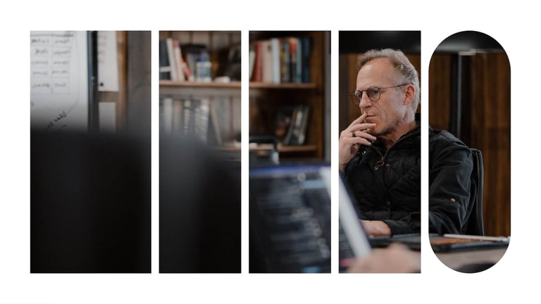 CEO of Ninety, Mark Abbott, seated and considering something during a meeting.