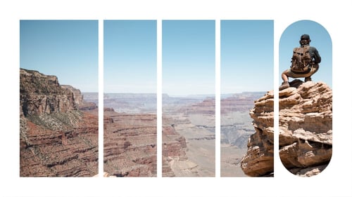 A person on top of a rock formation overlooking a canyon.