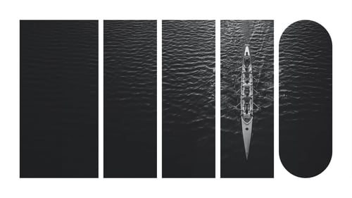 An overhead view of a crew team moving through the water.