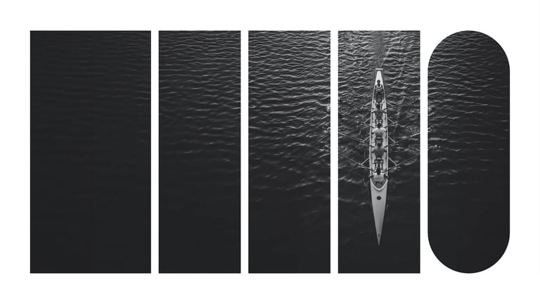 An overhead view of a crew team moving through the water.