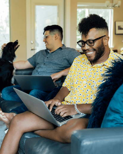 Two people work from home with their pets