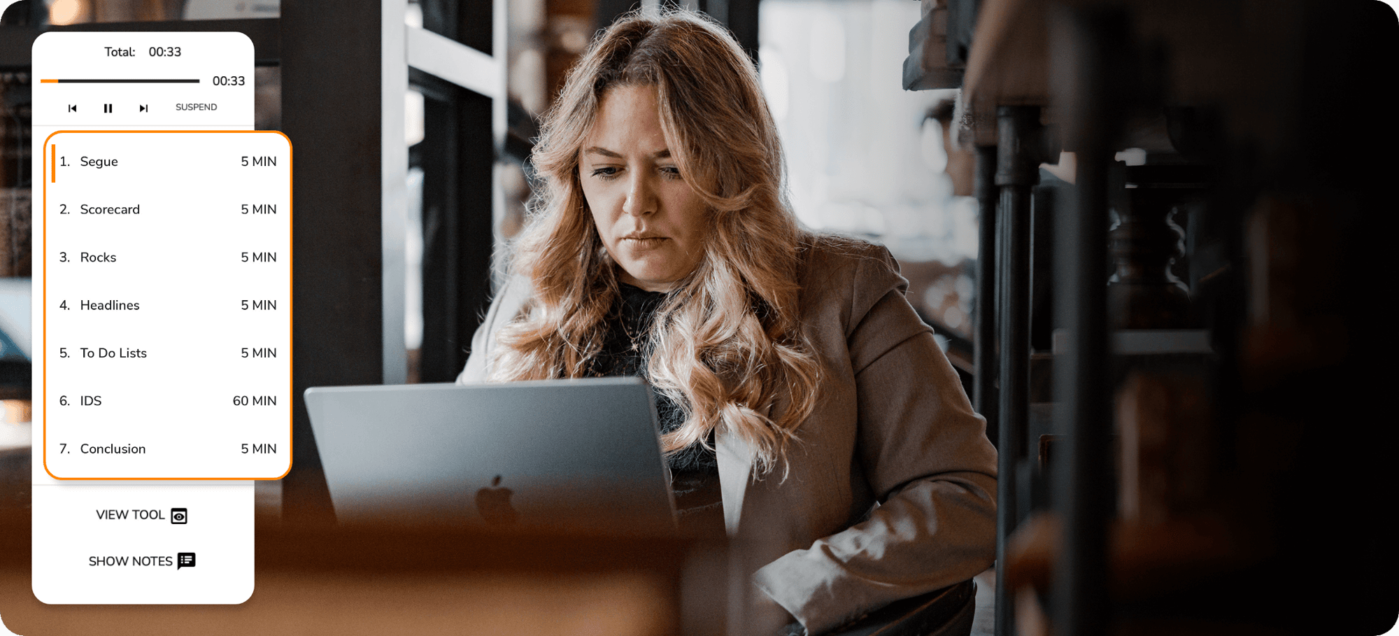 A woman working on her laptop using Ninety's meeting tool.