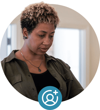 Woman using laptop with add user icon