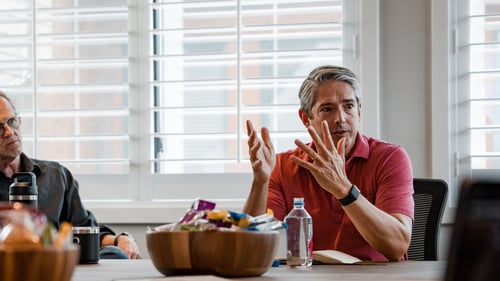 Man explaining business process to his team