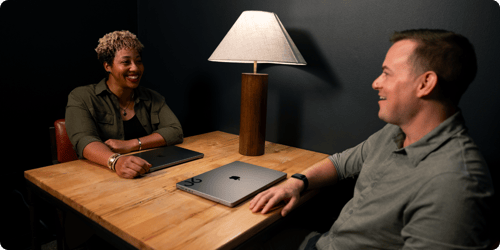 Two employees having a quarterly conversation