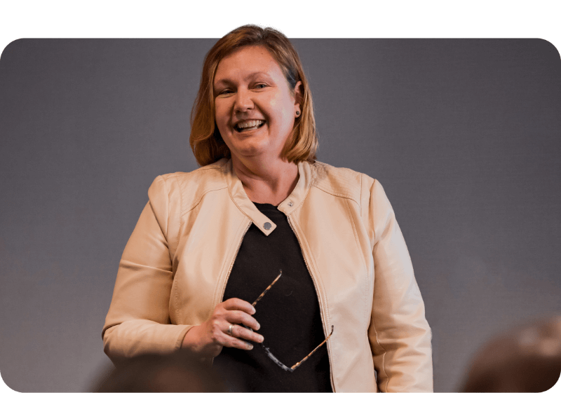 A woman speaking in a meeting