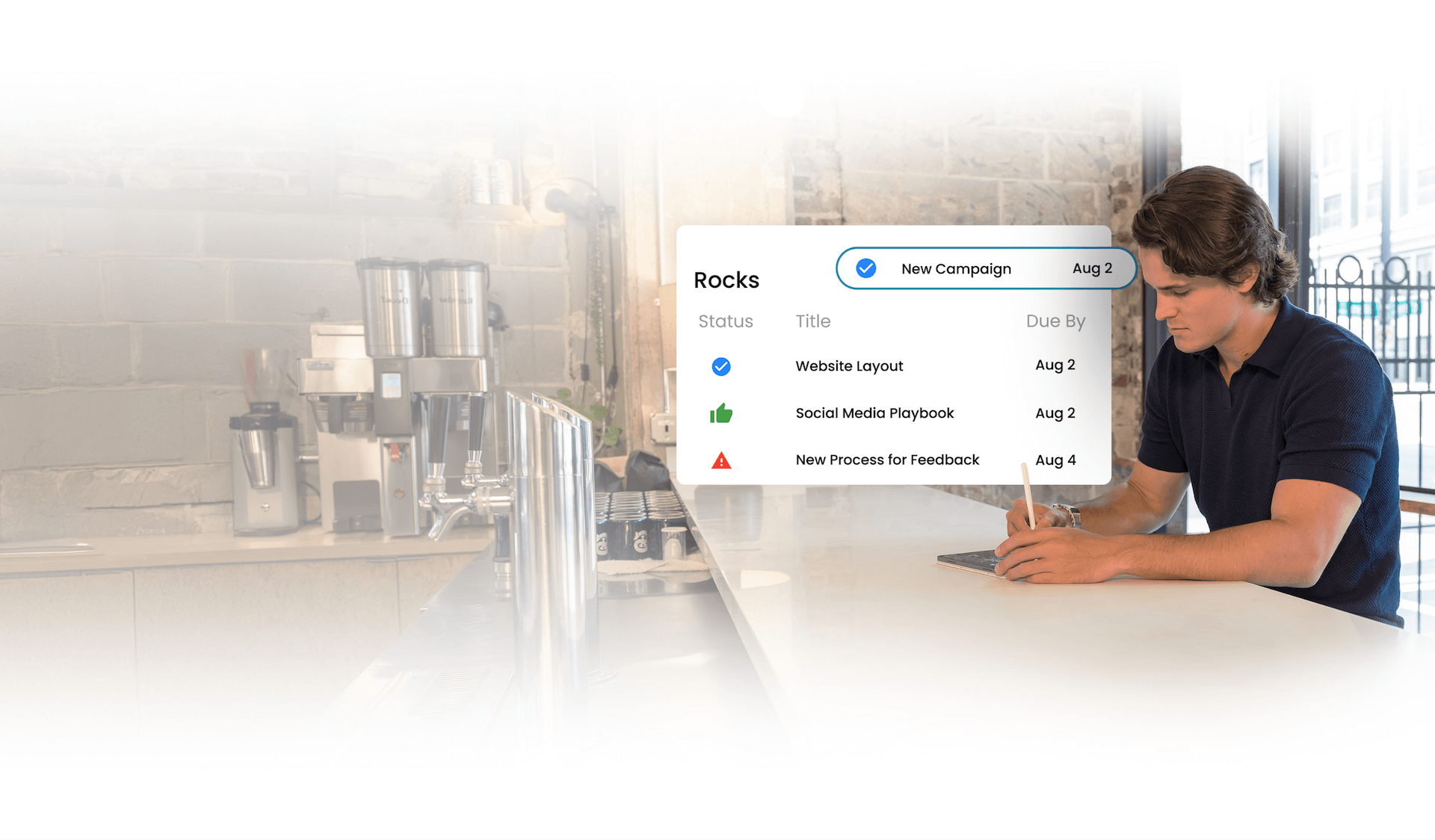 Young man seated at counter with digital overlay of a project management interface listing 'Rocks' with statuses and due dates.