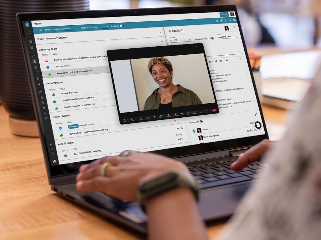 A woman using the Ninety app and viewing a webinar on her laptop.