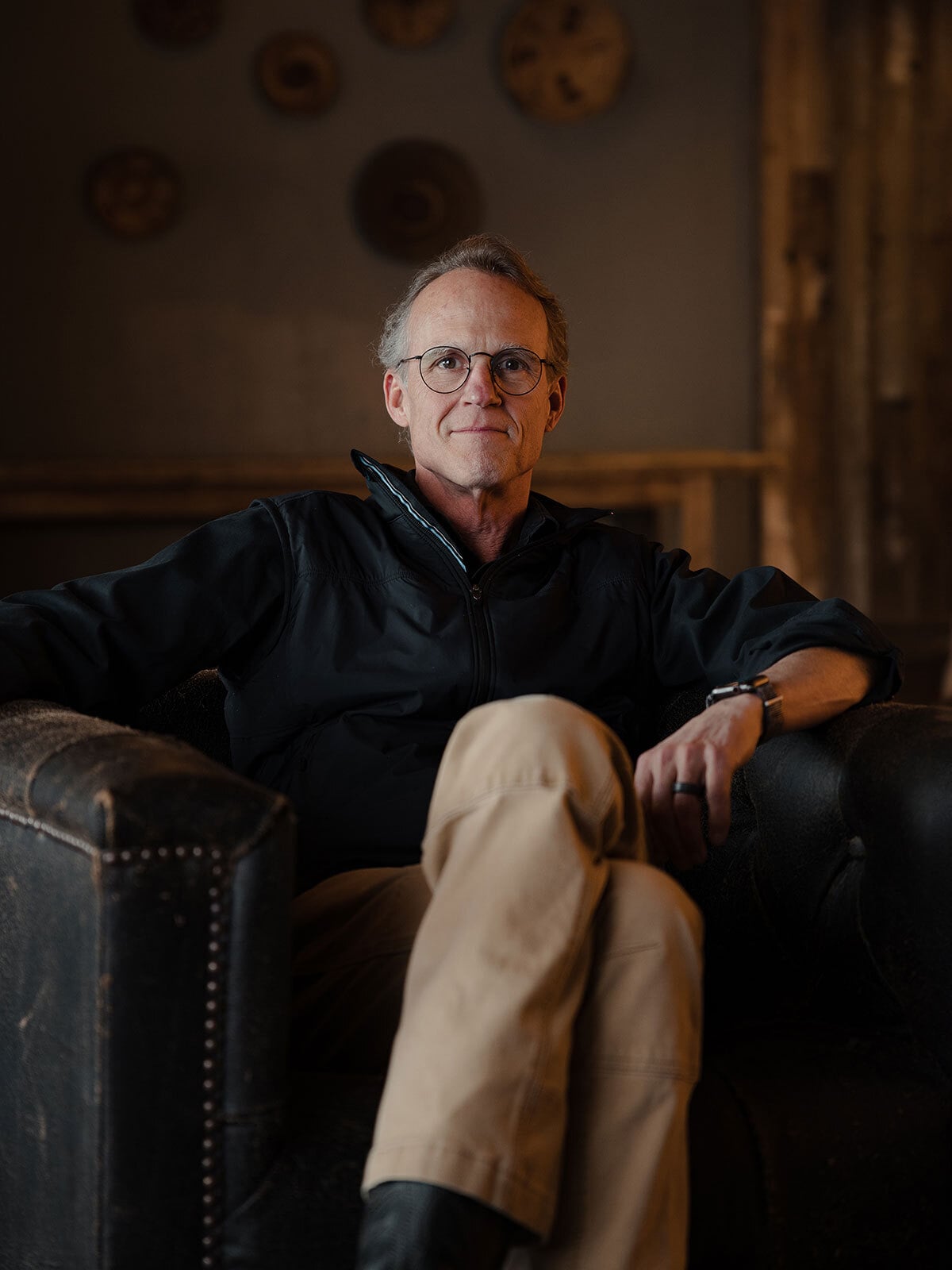 Mark Abbott, CEO of Ninety, posing for a portrait seated in a chair