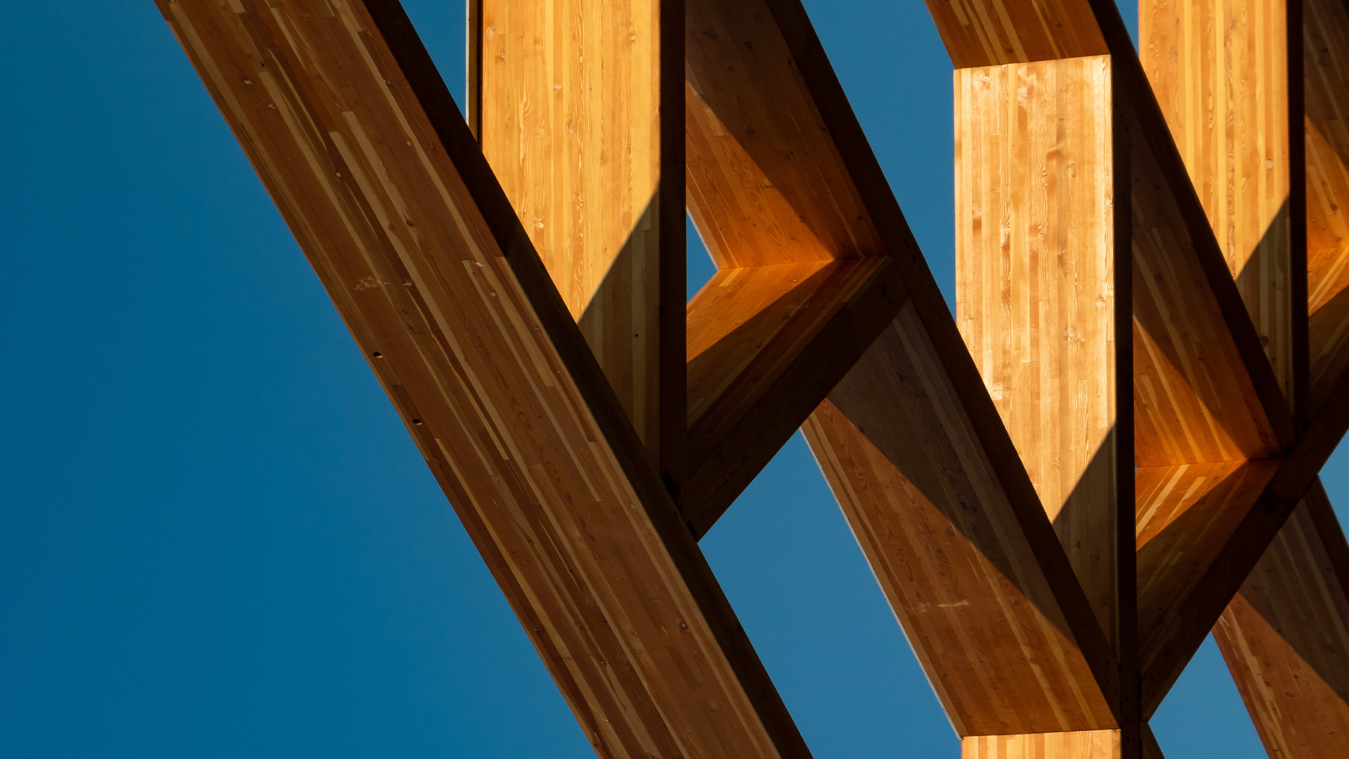 Rustic wood beams create a geometric pattern.