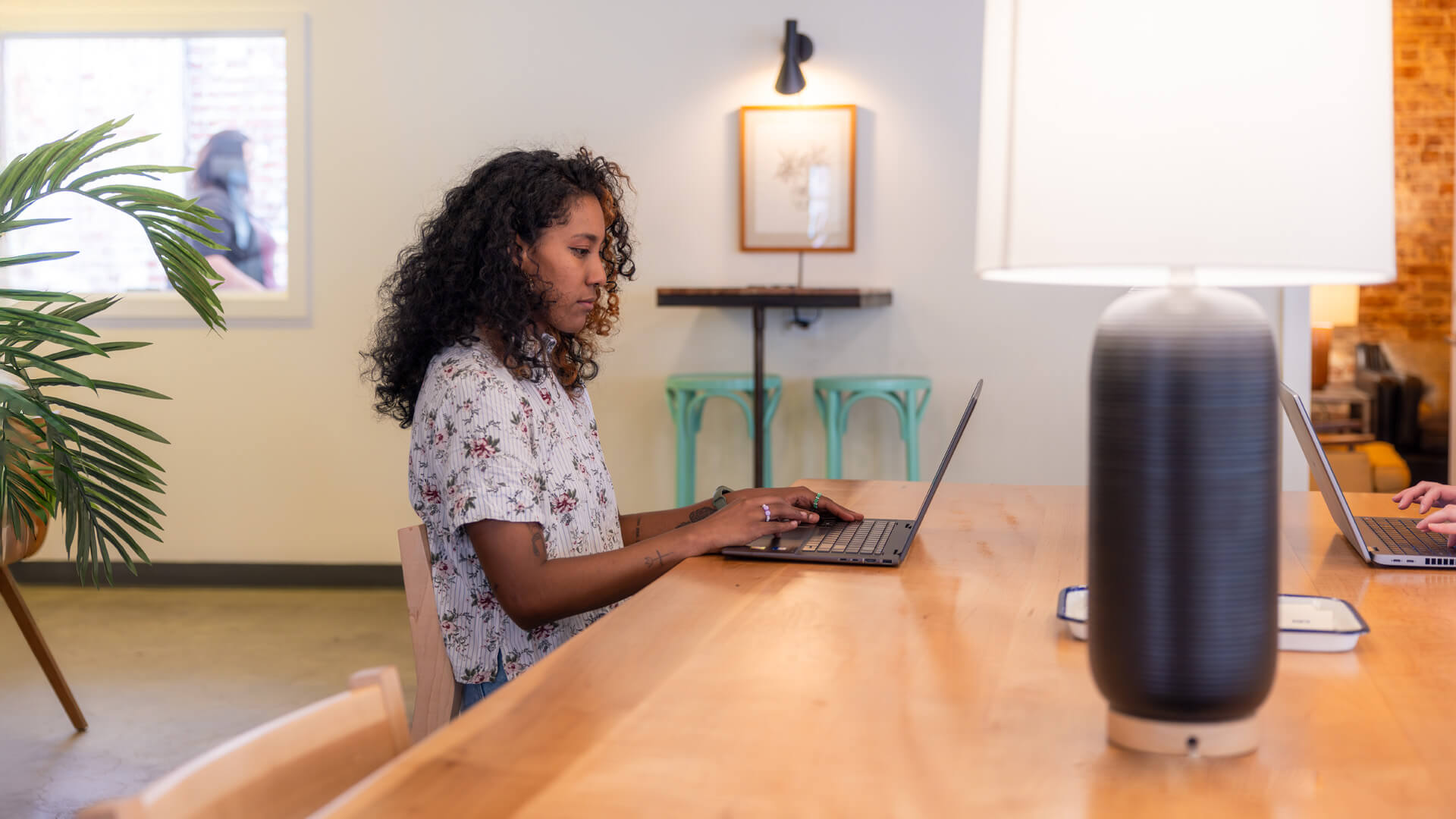 A woman types on a computer