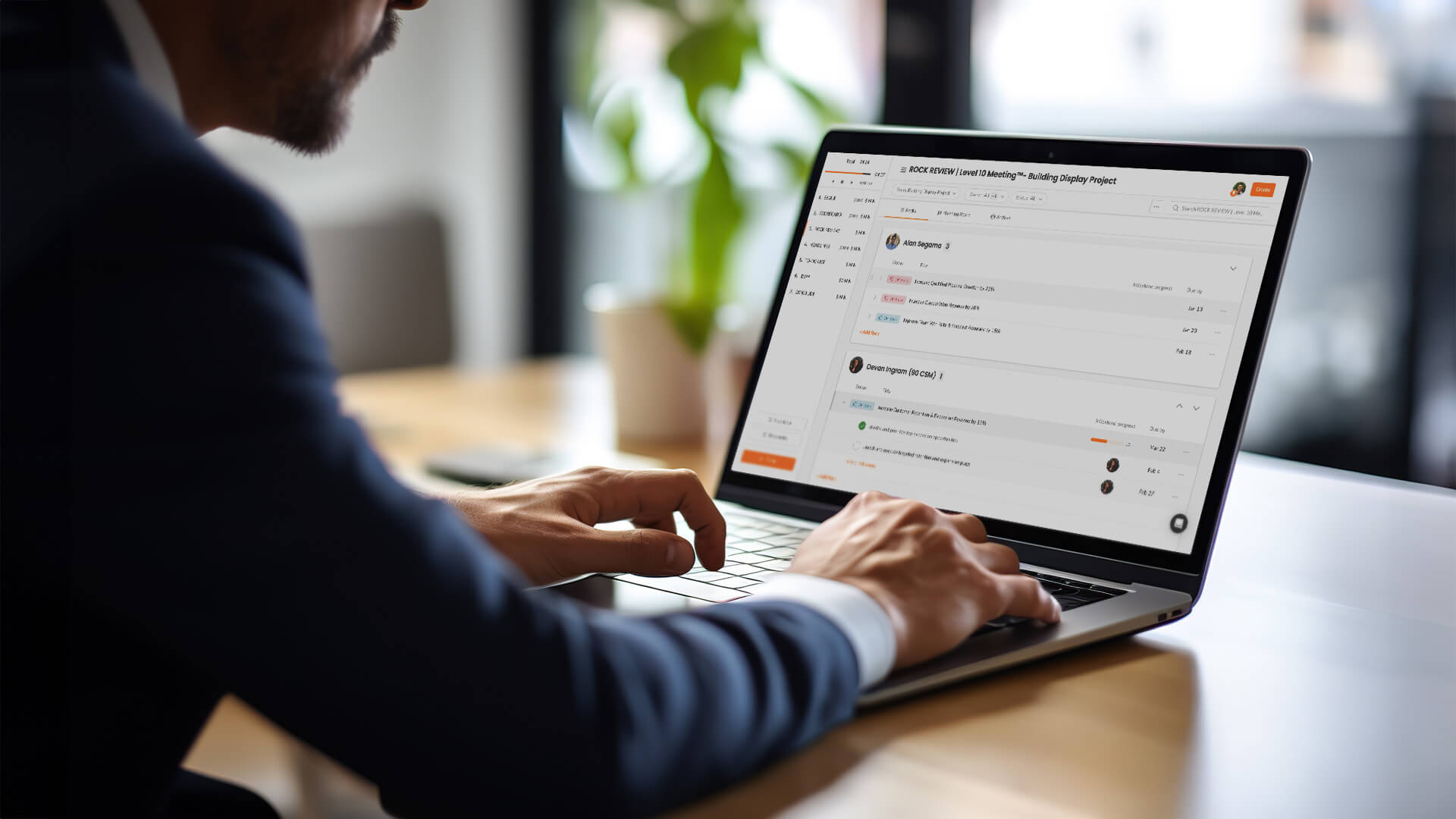 A person types on a laptop computer