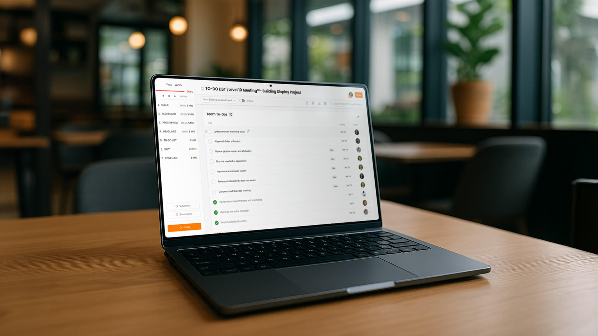 An open computer sits on a table.