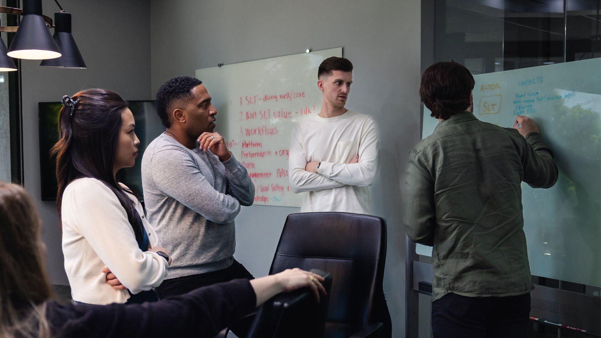 team members discussing operational efficiency in meeting
