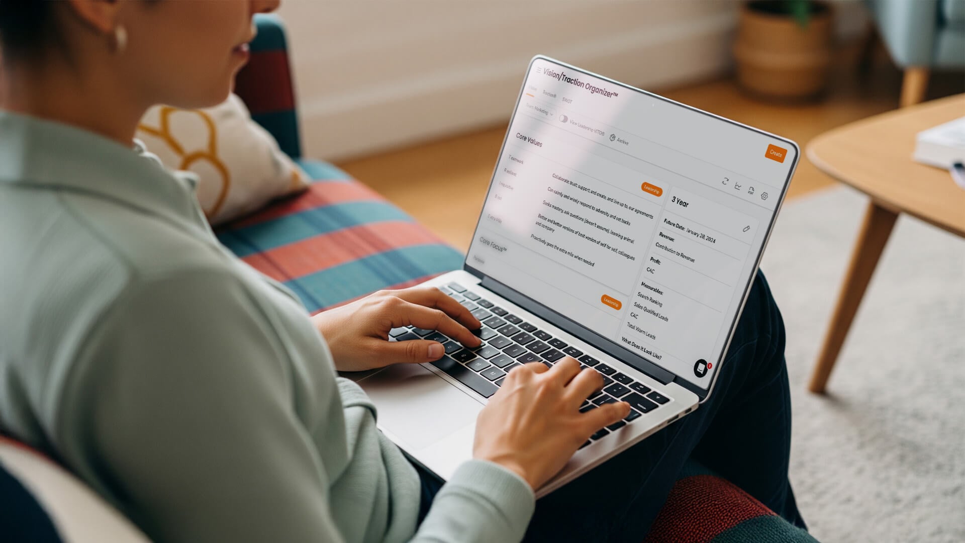 A person types on a laptop