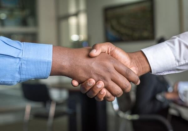 An image of shaking hands